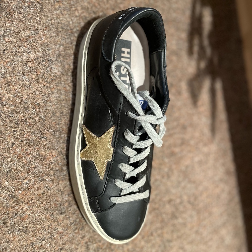 Barely worn black with gold hi star golden goose! Size 39.